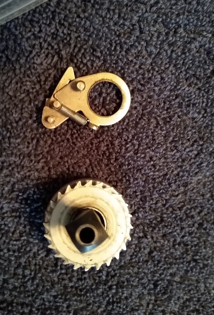 Carriage return ratchet, partly apart